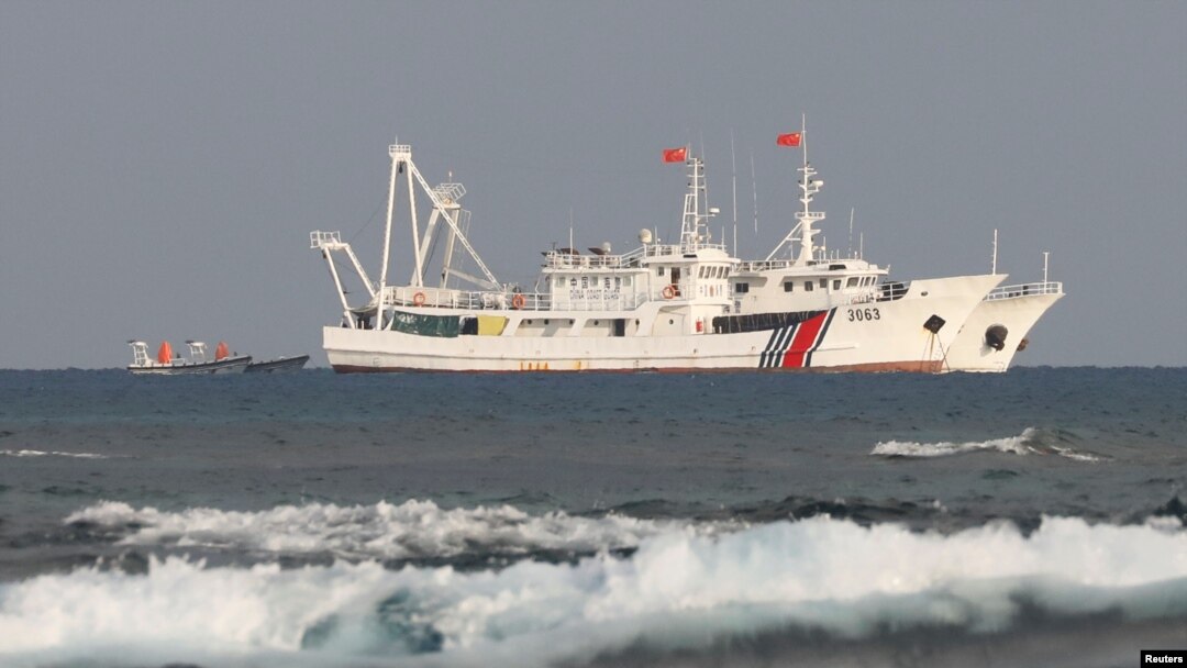 FILE - Chinese Coast Guard vessels are pictured in the South China Sea off the Philippines, April 5, 2017.