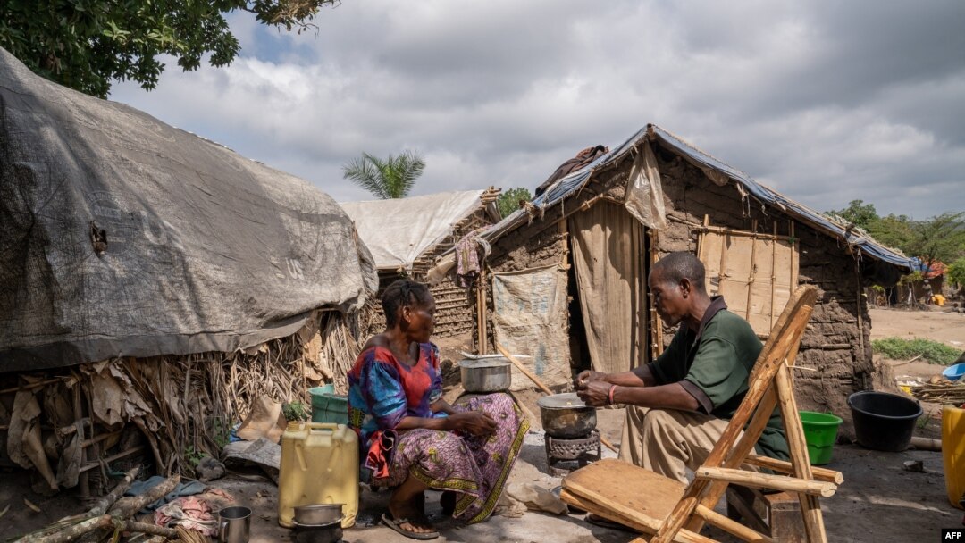 FILE - People displaced by conflict sit in a camp in Komanda, Ituri province, eastern Democratic Republic of the Congo, Aug. 30, 2023. There are over 6 million internally displaced people in the DRC.