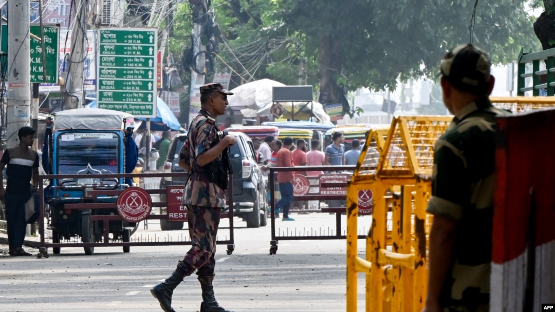 Border Security Force (BSF) personnel stand guard at the India-Bangladesh border of Petrapole about 100km north east of Kolkata, Aug. 6, 2024.