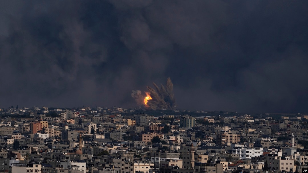 Fire and smoke rise following an Israeli airstrike, in Gaza City, Oct. 8, 2023. 