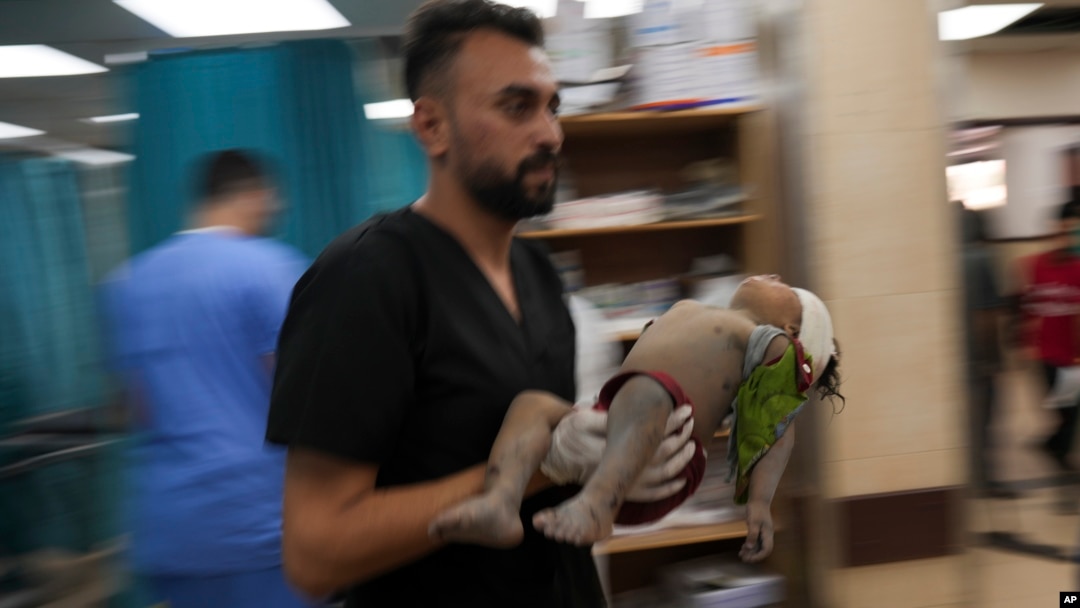 A Palestinian child wounded in an Israeli bombardment is carried into a hospital south of the Gaza Strip, Nov. 2, 2023. International humanitarian law seeks, for humanitarian reasons, "to limit the effects of armed conflict," says the International Committee of the Red Cross.