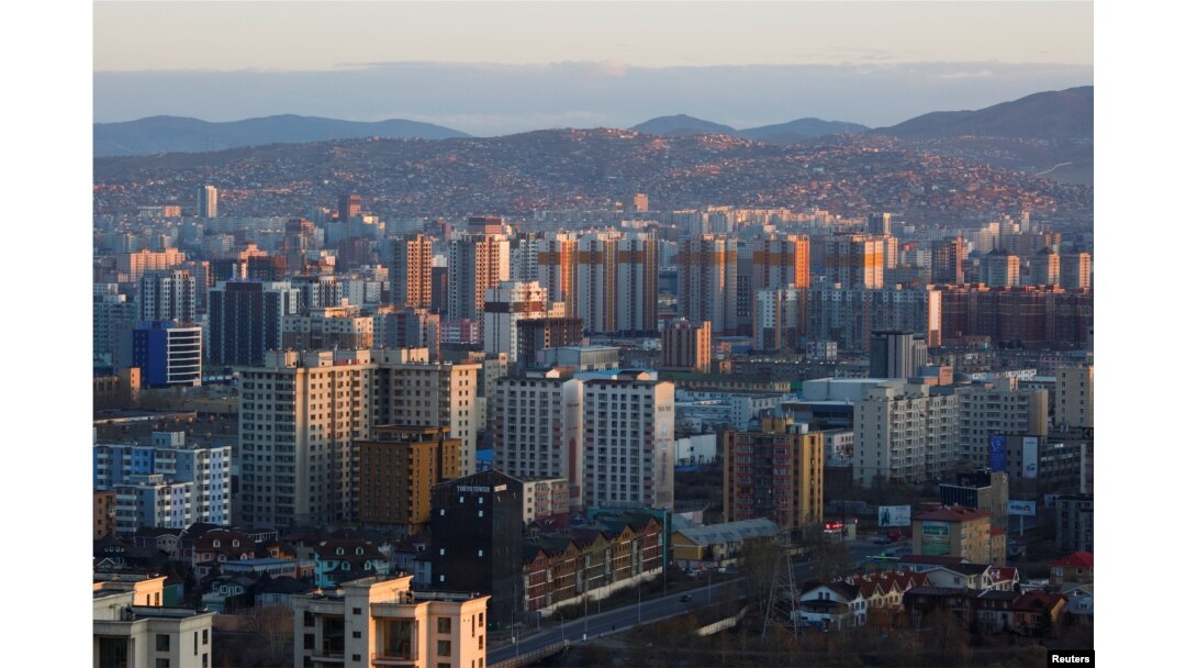The sun rises over Ulaanbaatar, the capital of Mongolia, May 1, 2018. On Friday, Mongolian police raided the office of a local news outlet in Ulaanbaatar.