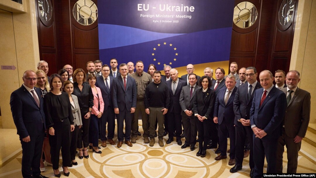 Ukrainian President Volodymyr Zelenskyy, center, poses for a photo with participants of an informal EU Foreign Ministers meeting in Kyiv, Oct. 2, 2023.