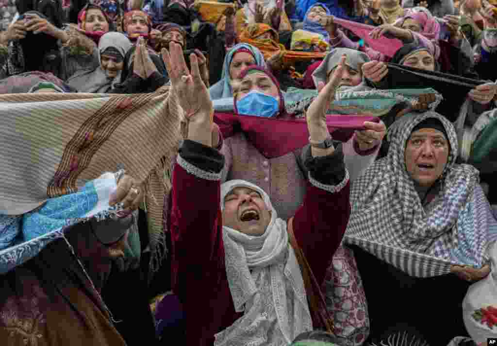 Kashmiri Muslims pray as the grand imam displays a relic at the Hazratbal shrine on the occasion of Mehraj-u-Alam, believed to mark the ascension of Prophet Muhammad to heaven, in Srinagar, Indian-controlled Kashmir.