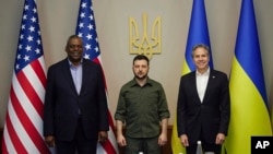 In this image from video provided by the Ukrainian Presidential Press Office and posted on Facebook, on Monday, April 25, 2022, from left; U.S. Secretary of Defense Lloyd Austin, Ukrainian President Volodymyr Zelenskyy and U.S. Secretary of State Antony B