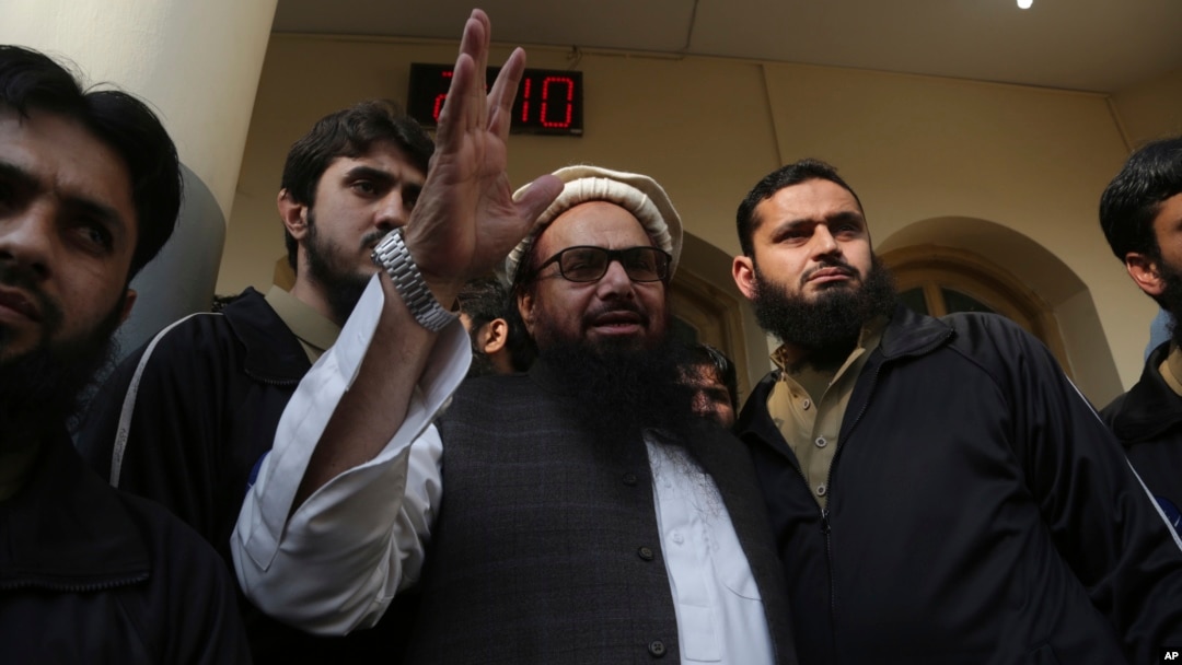 Hafiz Saeed, head of the Pakistan's Jamaat-ud-Dawa group waves to supporters at a mosque in Lahore, Pakistan, Nov. 24, 2017.