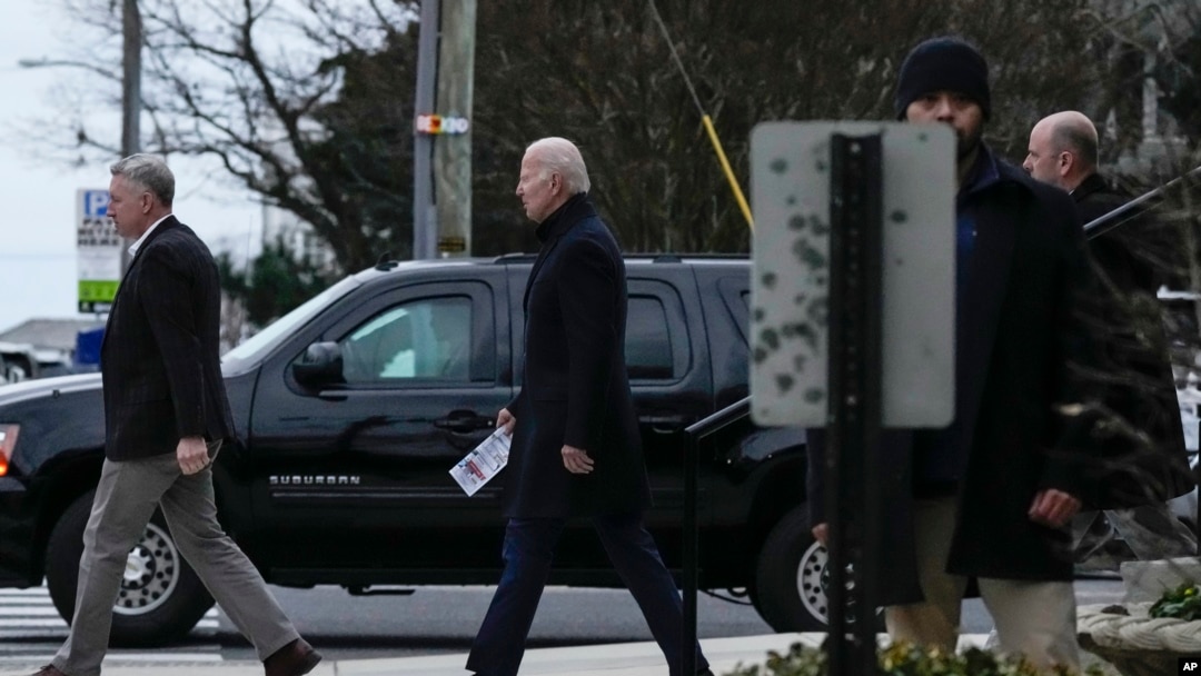 President Joe Biden walks from St. Edmund Roman Catholic Church after attending Mass in Rehoboth Beach, Del., Jan. 21, 2023. 