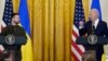 Ukrainian President Volodymyr Zelenskyy listens as President Joe Biden speaks during a news conference in the East Room of the White House in Washington, Dec. 21, 2022.