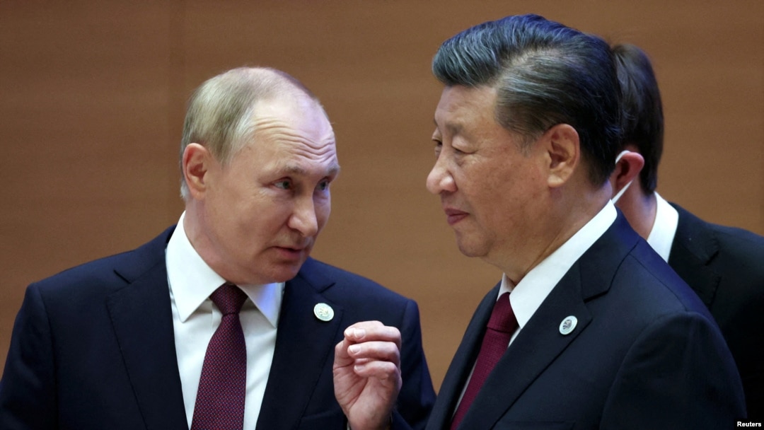 FILE - Russian President Vladimir Putin speaks with Chinese President Xi Jinping at the Shanghai Cooperation Organization summit in Samarkand, Uzbekistan, Sept. 16, 2022. (Sergei Bobylev, Sputnik, Kremlin Pool Photo via AP)