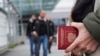 A person holds a Russian Passport at the Vaalimaa border crossing point between Russia and Finland, in Vaalimaa, Finland, Sept. 23, 2022.