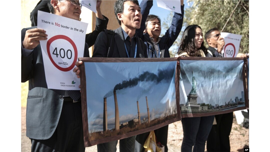 Activists stage a protest against man-made emissions of carbon dioxide and other global warming gases, at the COP22 climate change conference in Marrakech, Nov 16, 2016.