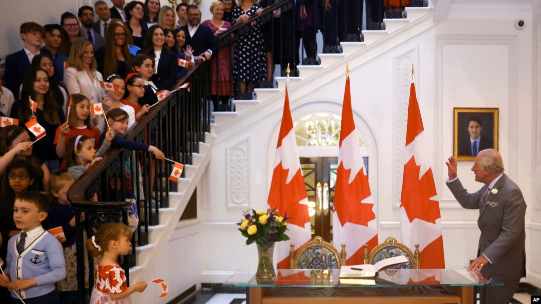 FILE - Britain's Prince Charles, now King Charles III, greets people during his visit to Canada House in London, May 12, 2022. 