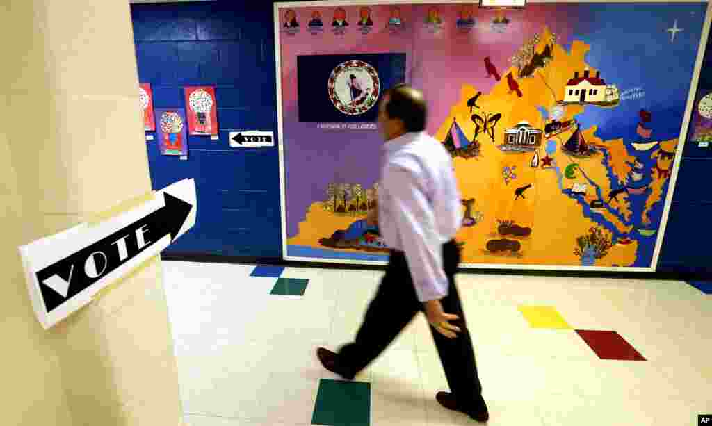 A voter heads in to cast his ballot during the presidential primary in Henrico, Virginia, March 1, 2016.