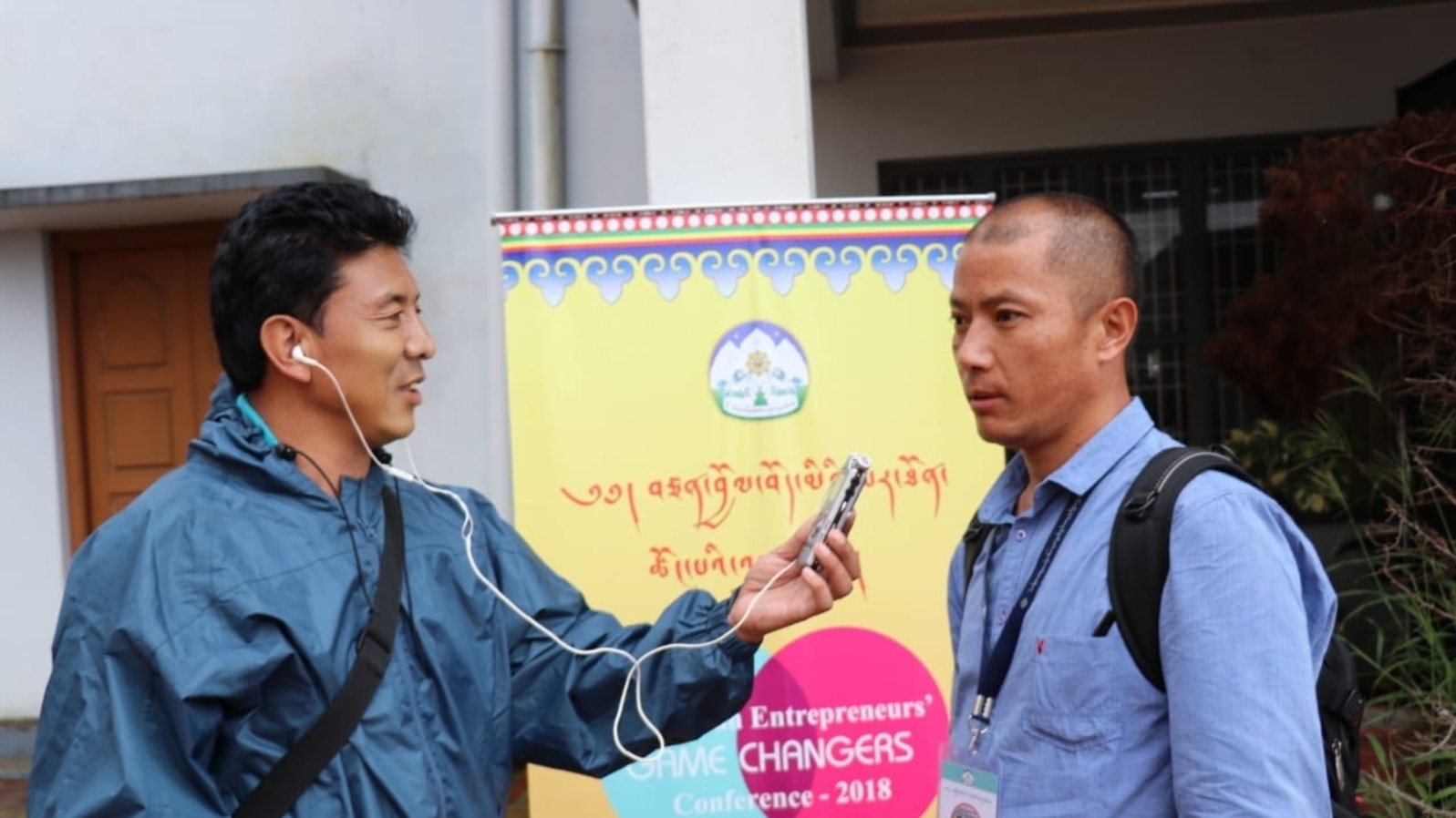 FILE - Gyaltsen Choedak, VOA Tibetan Service, is seen working at a conference in 2018. Many journalists reporting on events inside Tibet rely on messaging apps and sources who risk prison and retaliation against their families for speaking out. 