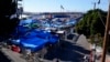 Frío y lluvias golpean carpas de migrantes en frontera EE.UU.-México