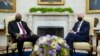 President Joe Biden, right, meets with Kenyan President Uhuru Kenyatta, left, in the Oval Office of the White House in Washington, Oct. 14, 2021.