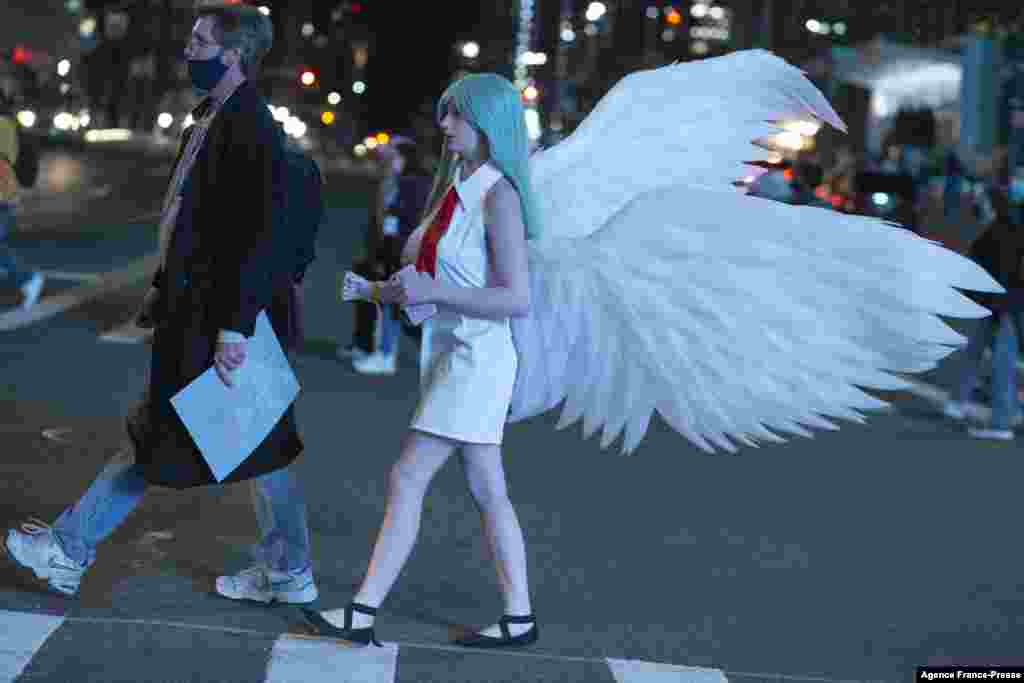 A cosplayer leaves Anime NYC at the Jacob K. Javits Convention Center in New York City, Nov. 20, 2021.