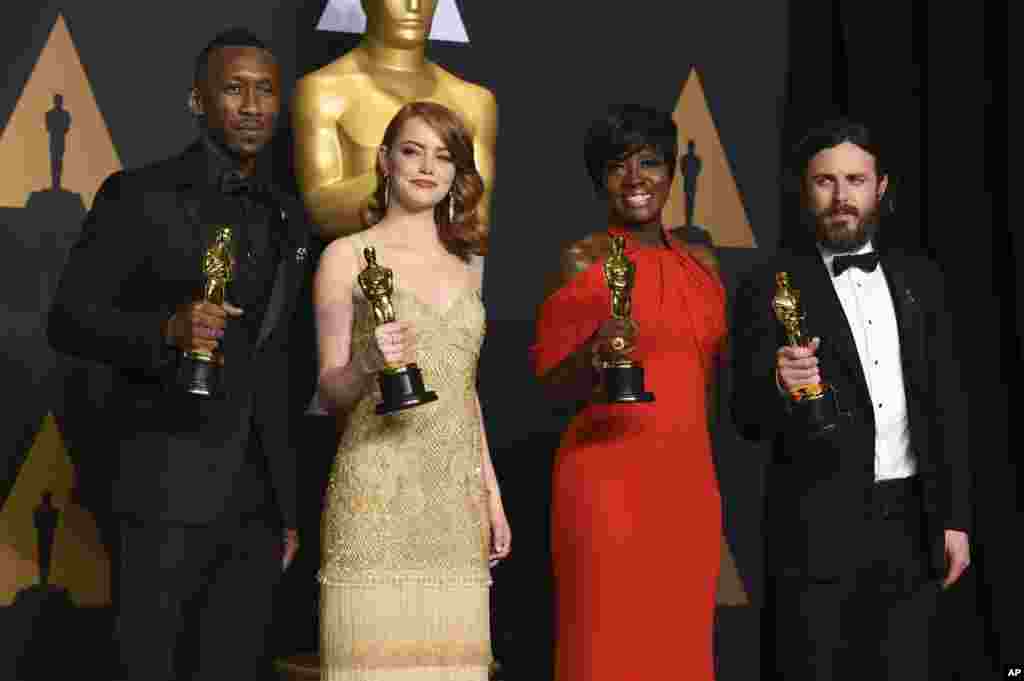 Mahershala Ali, winner of the award for best actor in a supporting role for &quot;Moonlight&quot;, from left, Emma Stone, winner of the award for best actress in a leading role for &quot;La La Land&quot;, Viola Davis, winner of the award for best actress in a supporting role for &quot;Fences&quot;, and Casey Affleck, winner of the award for best actor in a leading role for &quot;Manchester by the Sea&quot;, pose in the press room at the Oscars.
