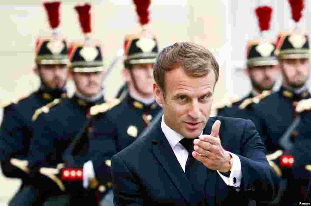 French President Emmanuel Macron gestures as he meets with Tajik President Emomali Rahmon (not pictured) at the Elysee Palace in Paris, France.