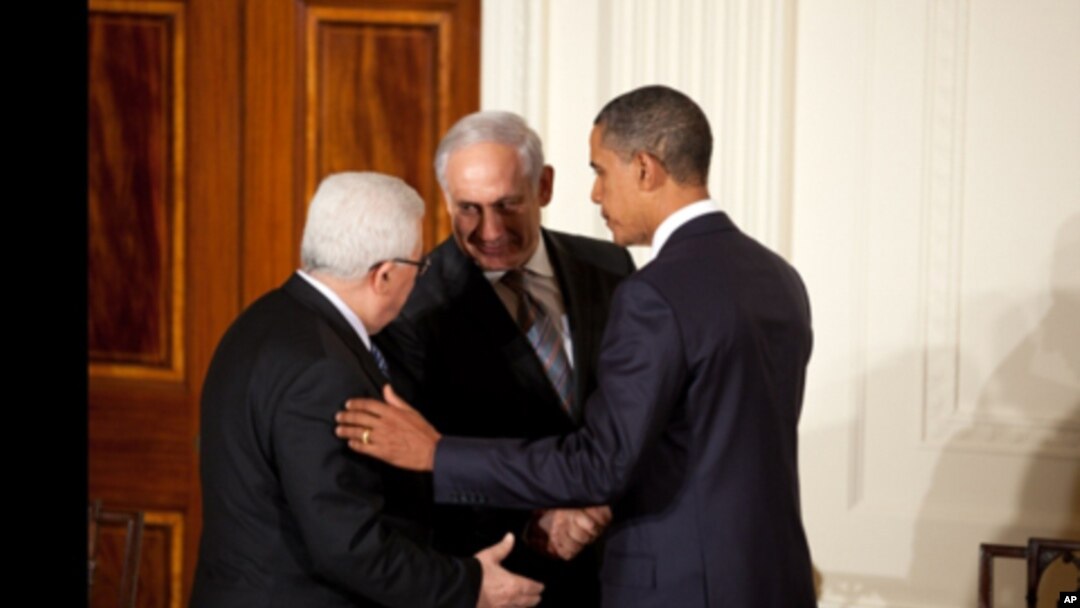 President Barack Obama talks with Palestinian President Mahmoud Abbas and Prime Minister Benjamin Netanyahu of Israel at the conclusion of a statement to the press in the East Room of the White House, Sept. 1, 2010.