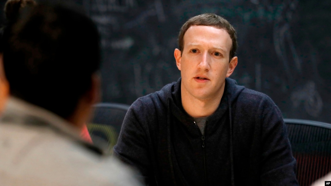 FILE - Facebook CEO Mark Zuckerberg meets with entrepreneurs and innovators during a round-table discussion in St. Louis, Nov. 9, 2017.