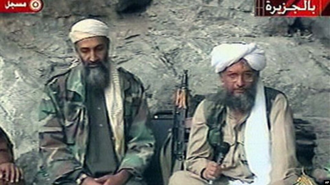 Osama bin Laden, left, and his top lieutenant, Egyptian Ayman al-Zawahri, right, are seen at an undisclosed location in this TV image broadcast, October 2001 (file photo)