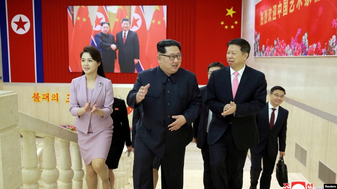 North Korean leader Kim Jong Un (center) meets Song Tao (right), the head of the China's Communist Party's International Department who led a Chinese art troupe to North Korea for the April Spring Friendship Art Festival, in this handout photo released by North Korea's Korean Central News Agency (KCNA) April 15, 2018.