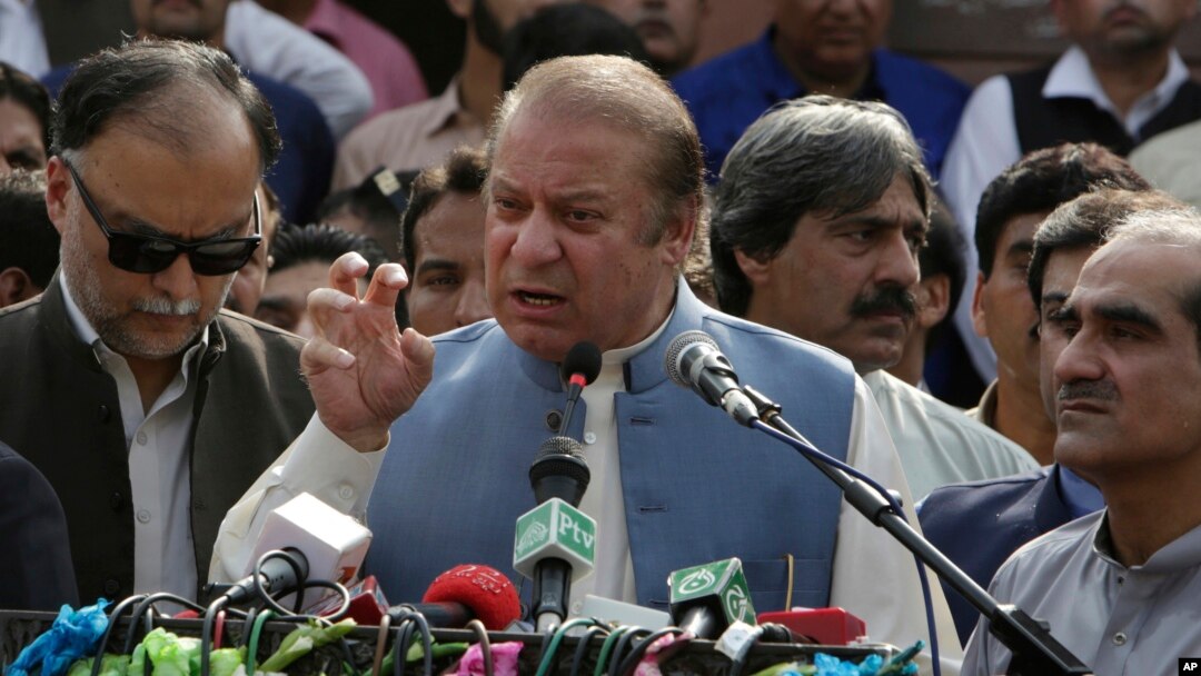 FILE - Nawaz Sharif addresses a crowd during his visit to a mausoleum of Pakistani poet Mohammad Iqbal on the occasion of Pakistan Independence Day in Lahore, Aug. 14, 2017.