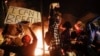 White US Policeman Charged with Murder in Black Man's Death