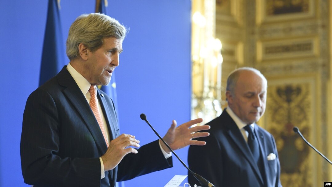 French Foreign Affairs Minister Laurent Fabius, right, U.S. Secretary of State John Kerry at joint press conference, Paris, March 7, 2015.