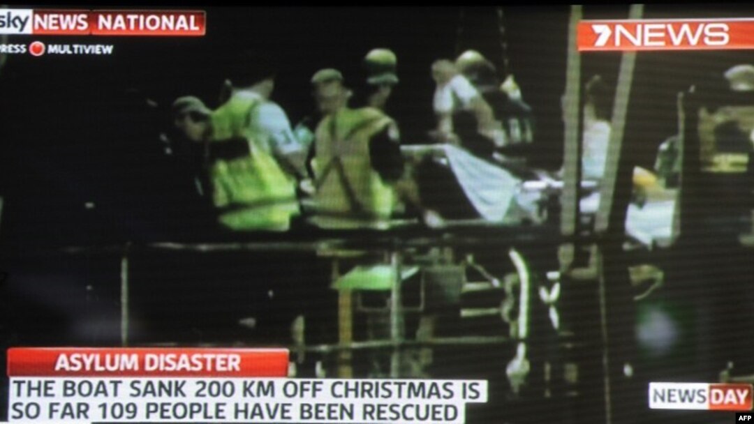 Screen grab shows asylum-seeker survivors arriving at Christmas Island after their boat capsized 120 nautical miles north of Christmas Island, 2,600 kilometres (1,600 miles) from the Australian mainland, June 22, 2012.