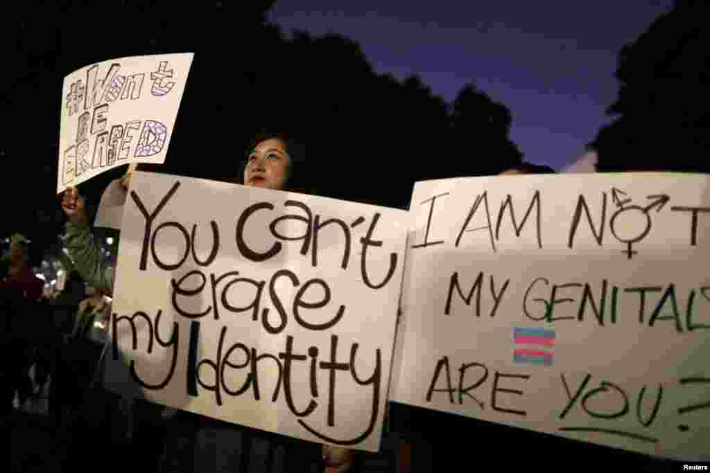 People rally to protest the Trump administration's reported transgender proposal to narrow the definition of gender to male or female at birth, in Los Angeles, California, Oct. 22, 2018.
