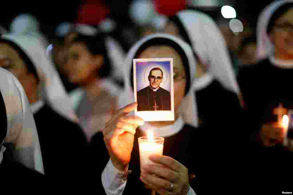 A nun participates in a procession prior to the canonization of the late Archbishop of San Salvador Oscar Arnulfo Romero in San Salvador, El Salvador, Oct. 13, 2018.