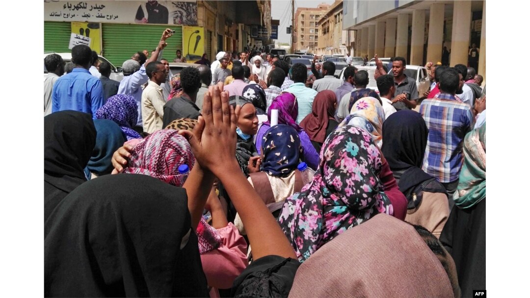 FILE - Sudanese protesters take part in an anti-government demonstration in Khartoum, Feb. 14, 2019.