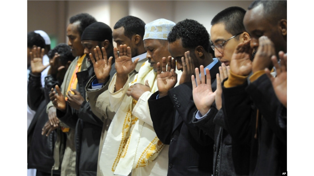 FILE - Several thousand Muslims pray together to mark the Eid al-Adha holiday Monday Dec.8, 2008 at the Minneapolis Convention Center.