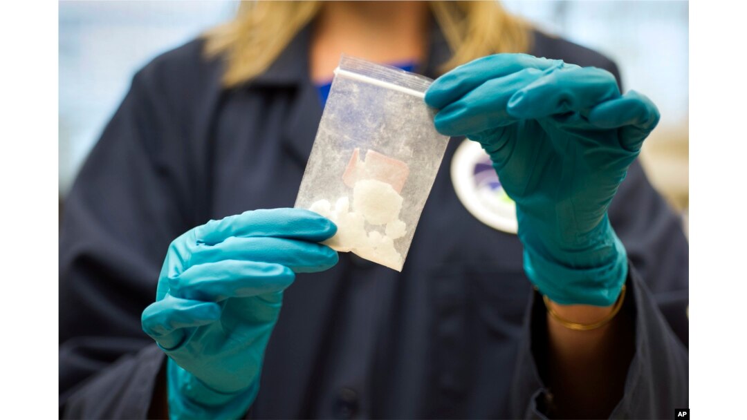 FILE - A bag of 4-fluoro isobutyryl fentanyl which was seized in a drug raid is displayed at the Drug Enforcement Administration (DEA) Special Testing and Research Laboratory in Sterling, Virginia, Aug. 9, 2016.