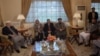 Aides to Fugitive Afghan Warlord Take Part in Peace Talks