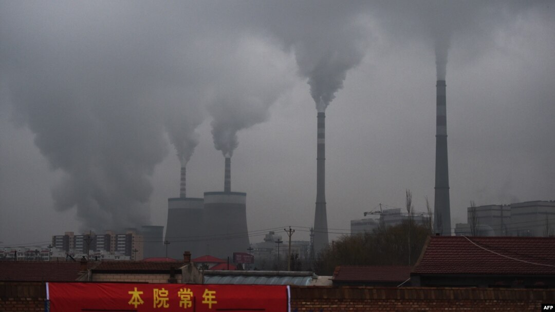 FILE - In this photo taken on Nov. 19, 2015, smoke belches from a coal-fueled power station near Datong, in China's northern Shanxi province.