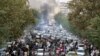  FILE - In this photo taken by an individual not employed by the Associated Press and obtained by the AP outside Iran, protesters chant slogans during a protest over the death of a woman who was detained by the morality police, in downtown Tehran, Iran, Sept. 21, 2022. 