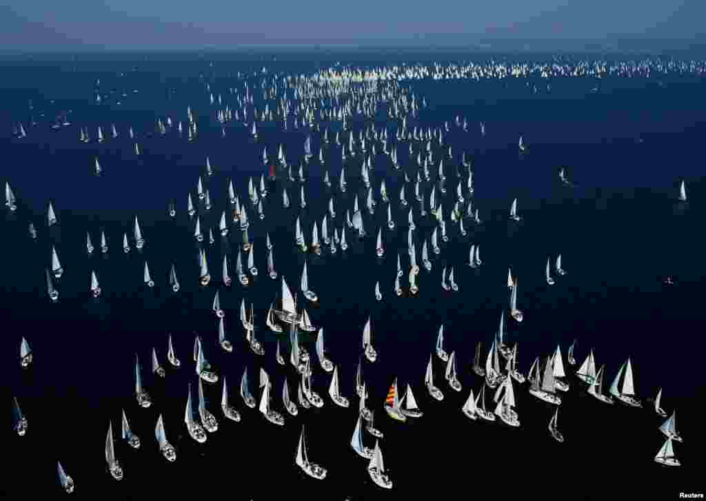 Sailboats gather during the Barcolana regatta in front of the Trieste harbor, Italy.
