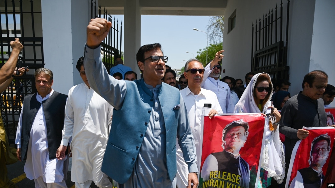 Parliamentarians of the Pakistan Tehreek-e-Insaf party carry posters of jailed former Prime Minister Imran Khan, during a protest outside the Parliament house in Islamabad on July 18, 2024. The party on July 20 said several members were "abducted."