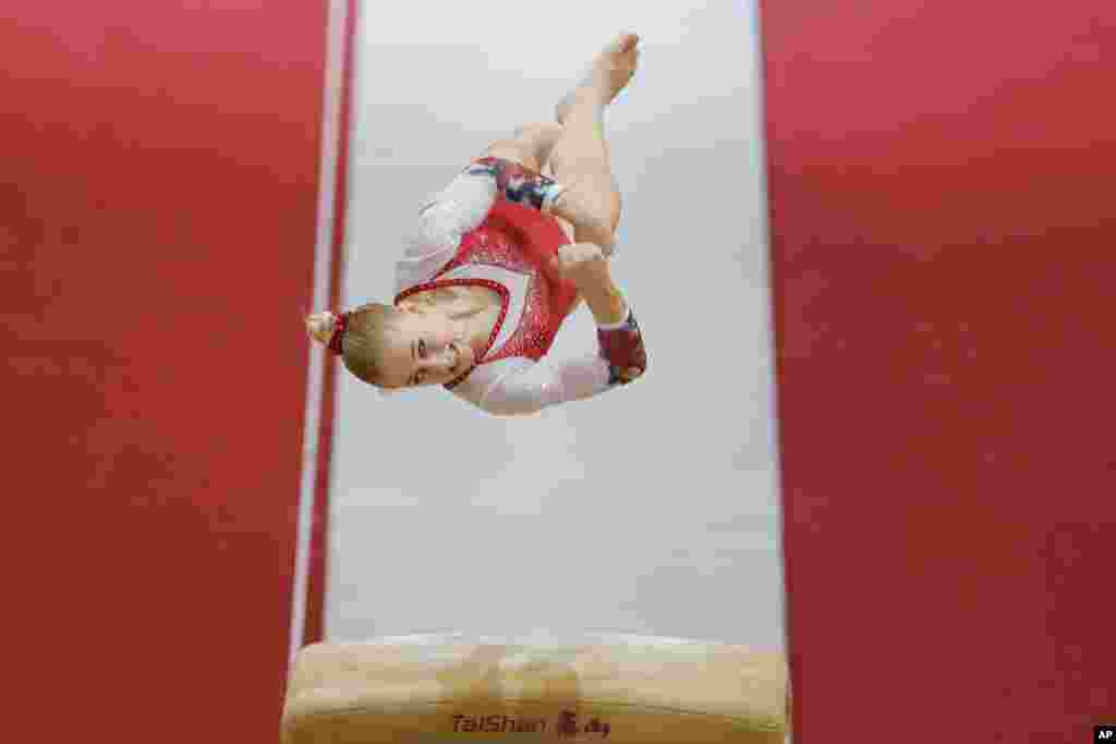 Russia's Liliia Akhaimova performs on the vault during qualifying sessions for the Gymnastics World Chamionships at the Aspire Dome in Doha, Qatar.