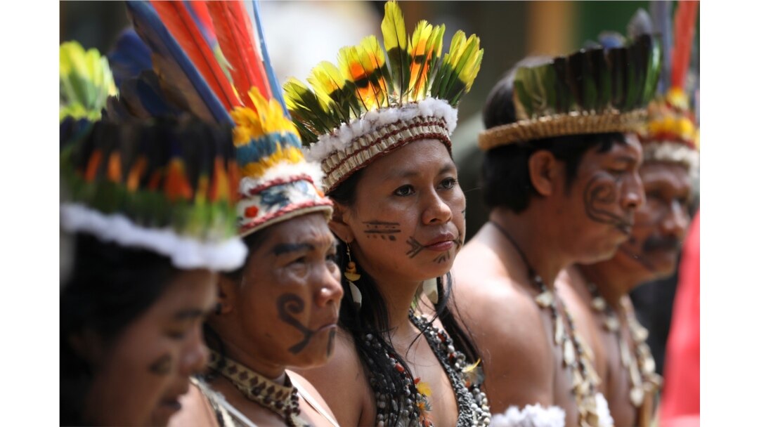 Representatives of the Huitoto and Ticuna indigenous communities wait whileleaders of several South American nations that share the Amazon are meeting, in Leticia, Colombia, Sept. 6, 2019.