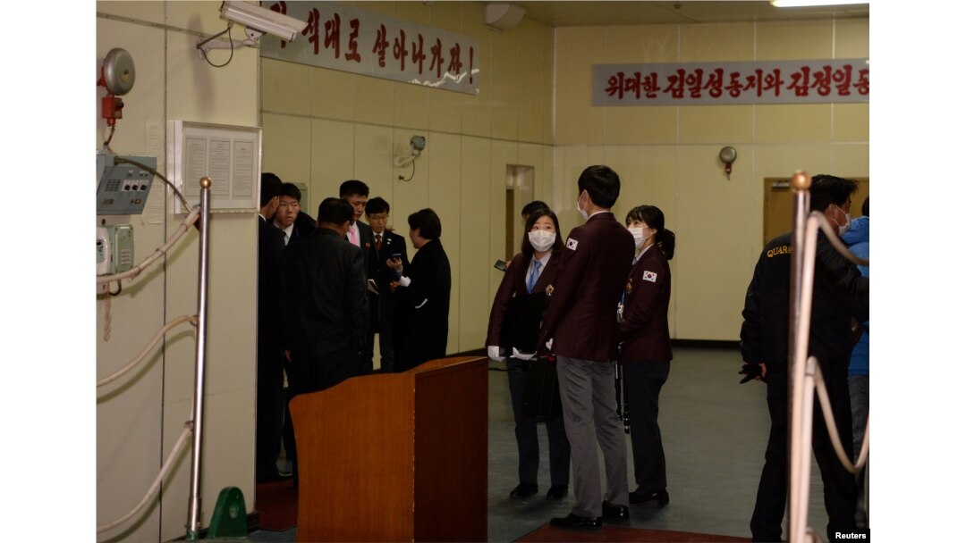 Customs officials are seen onboard of the North Korean ship Mangyongbong-92 carrying the Samjiyon art troupe at Mukjo port in Donghae, South Korea, Feb. 6, 2018