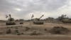 Iraqi tanks deploy in the village of Bashir, south of Kirkuk, Iraq, Oct. 13, 2017. 