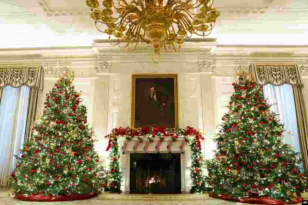 The State Dining Room of the White House is decorated for the holiday season during a press preview of the White House holiday decorations, Nov. 29, 2021.