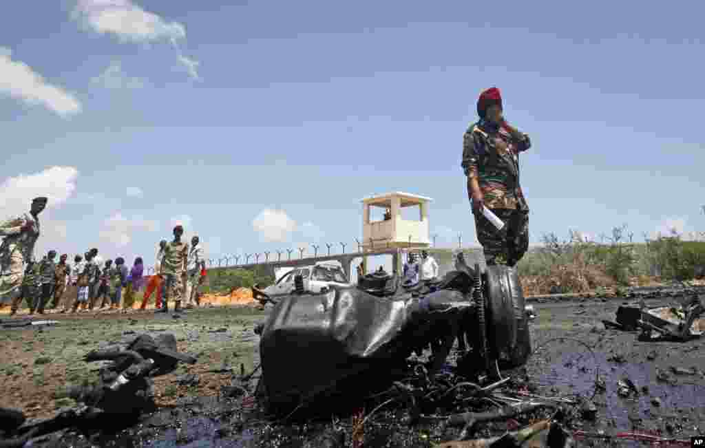 Somali security forces attend the scene after an attack on a European Union military convoy in the capital Mogadishu, Somalia.