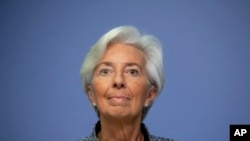 FILE -- In this Thursday, March 12, 2020 file photo the President of European Central Bank Christine Lagarde looks up prior to a press conference following a meeting of the ECB governing council in Frankfurt, Germany. The European Central Bank has…