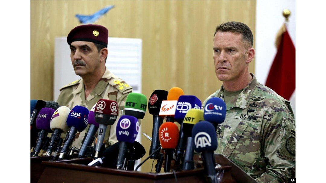 U.S. Army Col. Ryan Dillon, spokesman for Operation Inherent Resolve, the U.S.-led coalition against the Islamic State group, right, and Iraq armed forces spokesman Gen. Yahyah Rasul hold a press conference in Baghdad, Iraq, Thursday, Sept. 21, 2017.