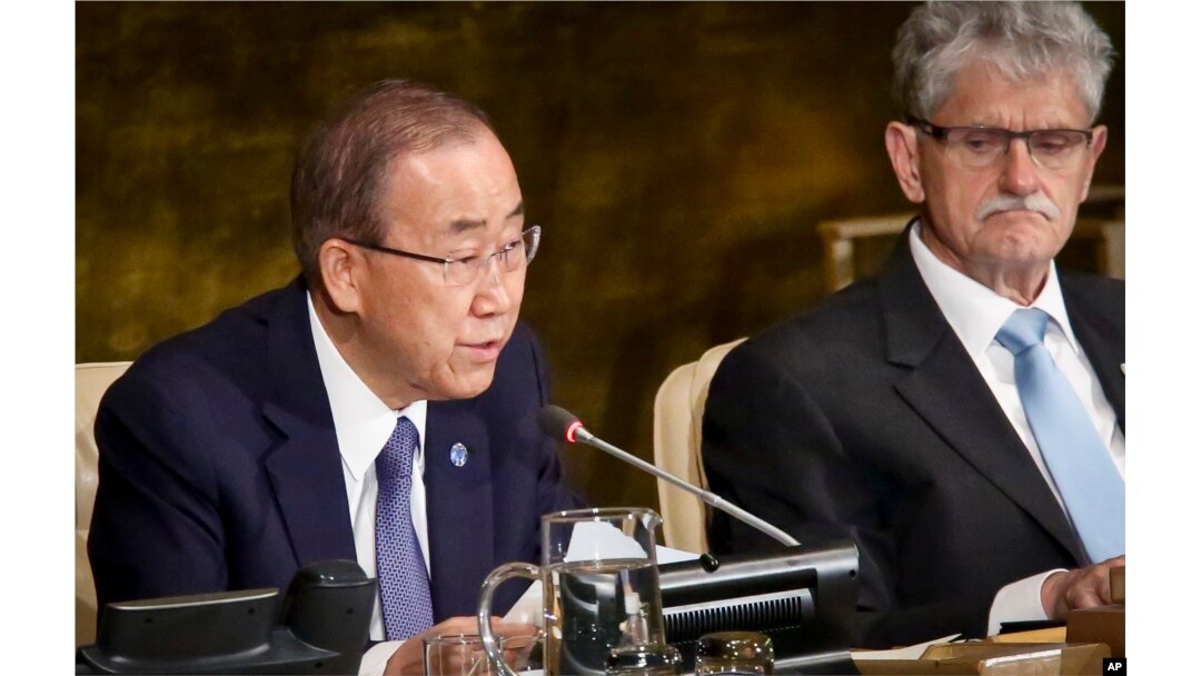 President of the U.N. General Assembly Mogens Lykketoft, right, listens as U.N. Secretary-General Ban Ki-moon address the opening of a high-level meeting on ending AIDS, June 8, 2016.